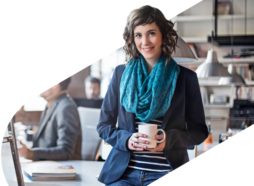 Lady smiling holding a mug