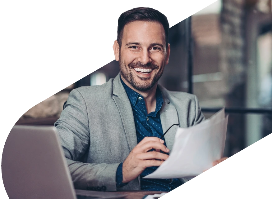 Man smiling with laptop